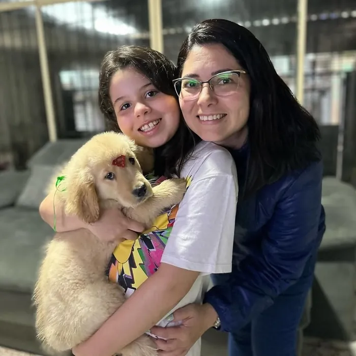 Família cliente do Canil Golden Prime: Dona Márcia e a pequena Sofia
