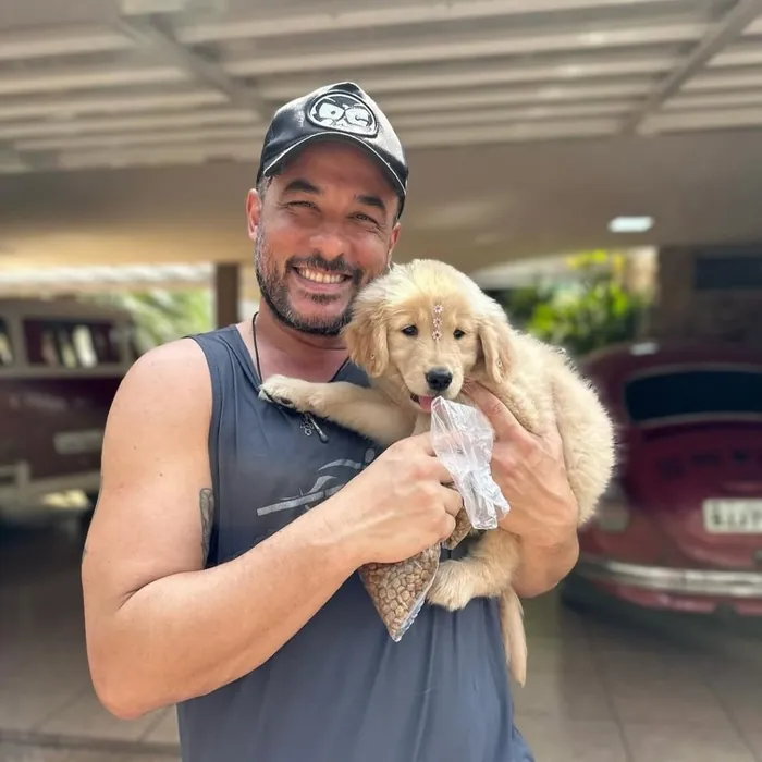 Família cliente do Canil Golden Prime: Seu Carlos e a Nina